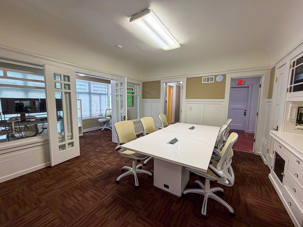 Conference room with meeting table and office chairs