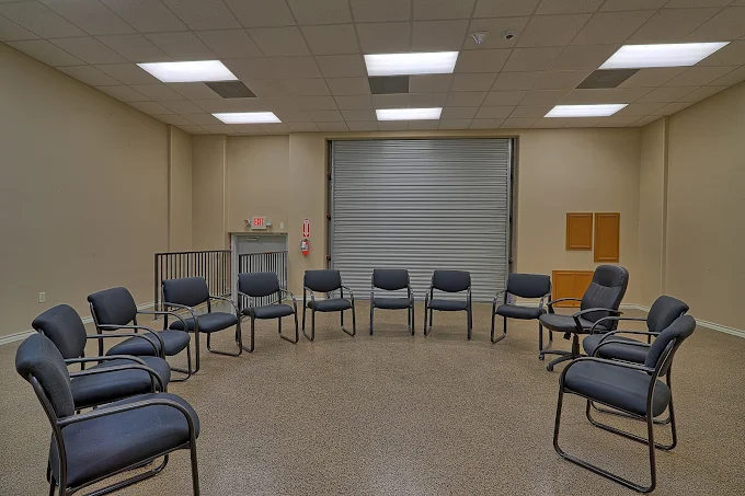 Chairs arranged in a circle in spacious meeting room