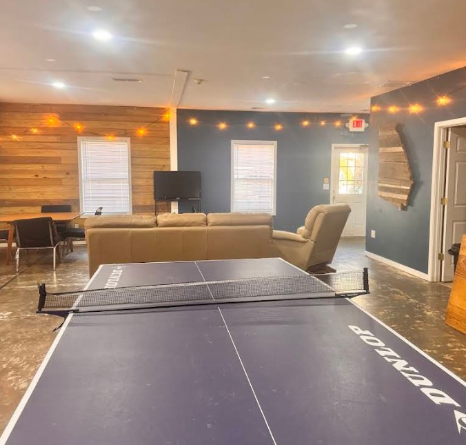 Recreation lounge with ping pong table and seating