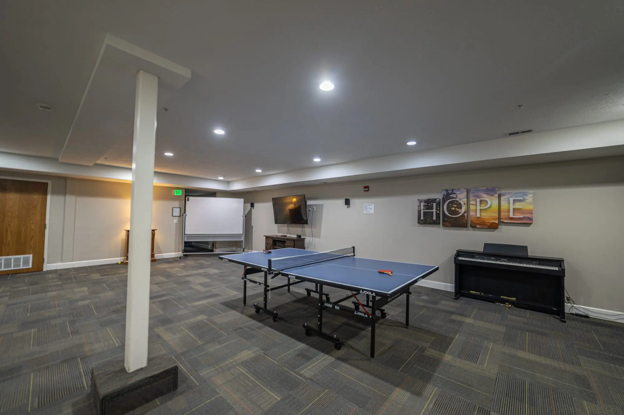 Recreation room with ping-pong table and seating area