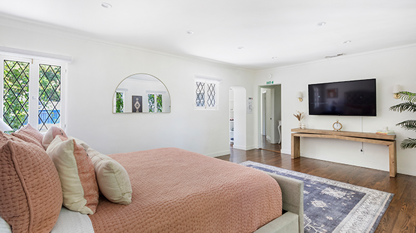 Spacious suite with king bed, TV, and seating area