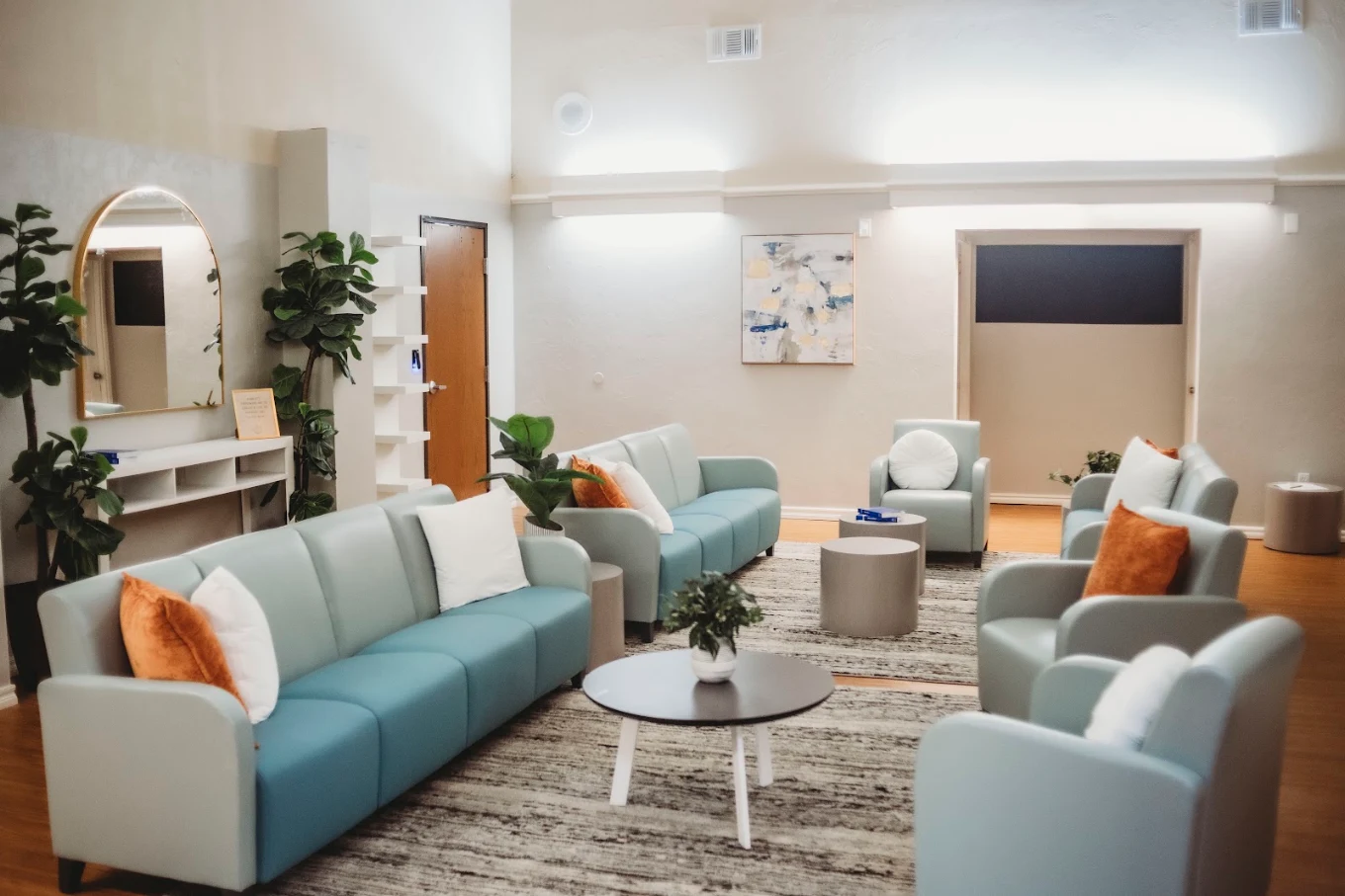 Comfortable client lounge with sofas, chairs, and coffee tables