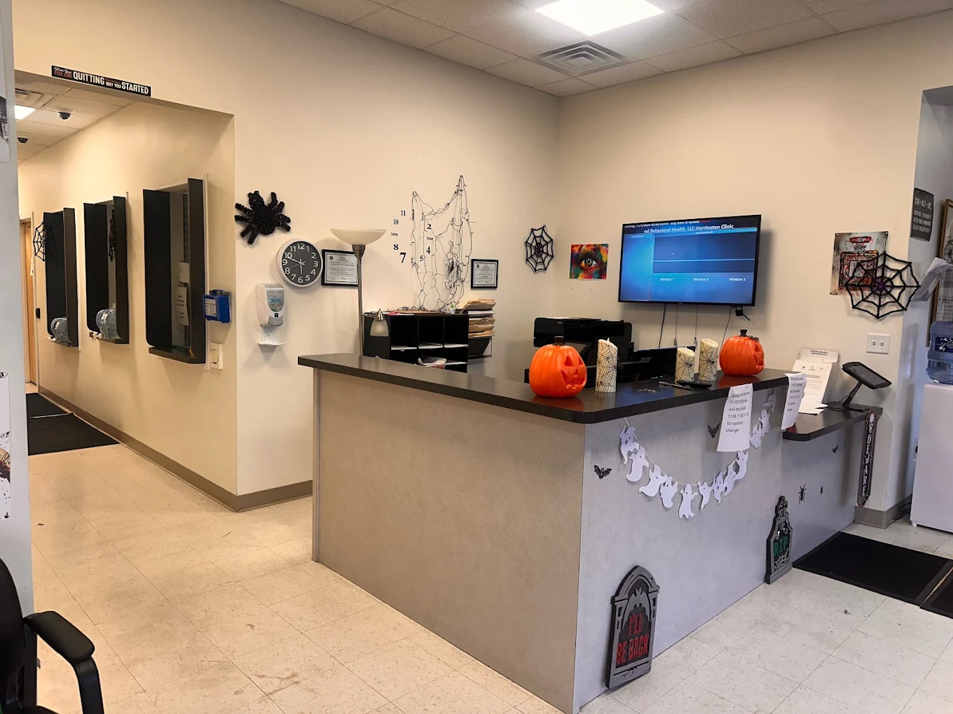 Reception counter decorated with pumpkins and spiderwebs