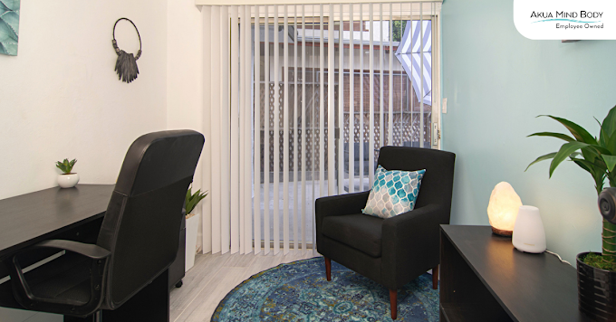 Private counseling room with desk and lounge chair