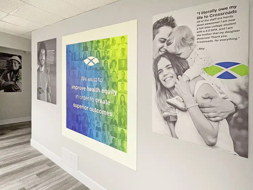 Hallway with colorful mission statement and photo posters