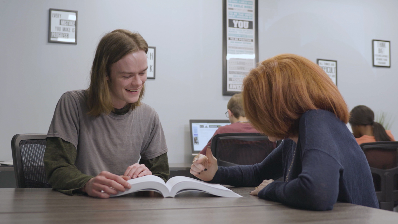 Two people studying together at a table.
