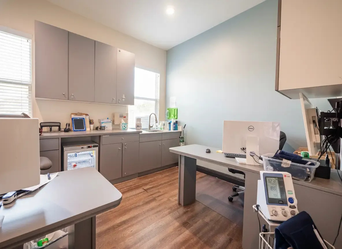 Bright medical office with equipment and workstation.
