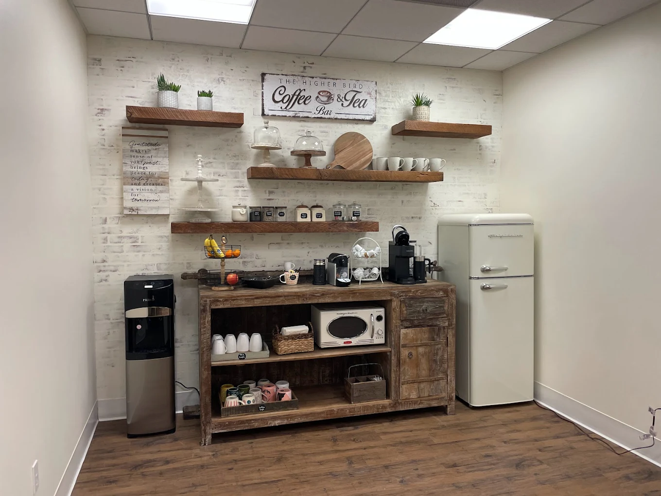 Cozy beverage station with shelves and small fridge