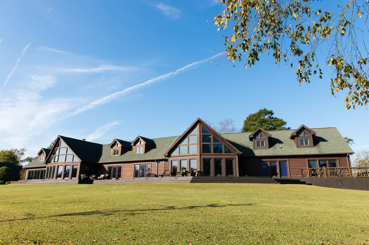 Rear exterior of lodge with spacious lawn