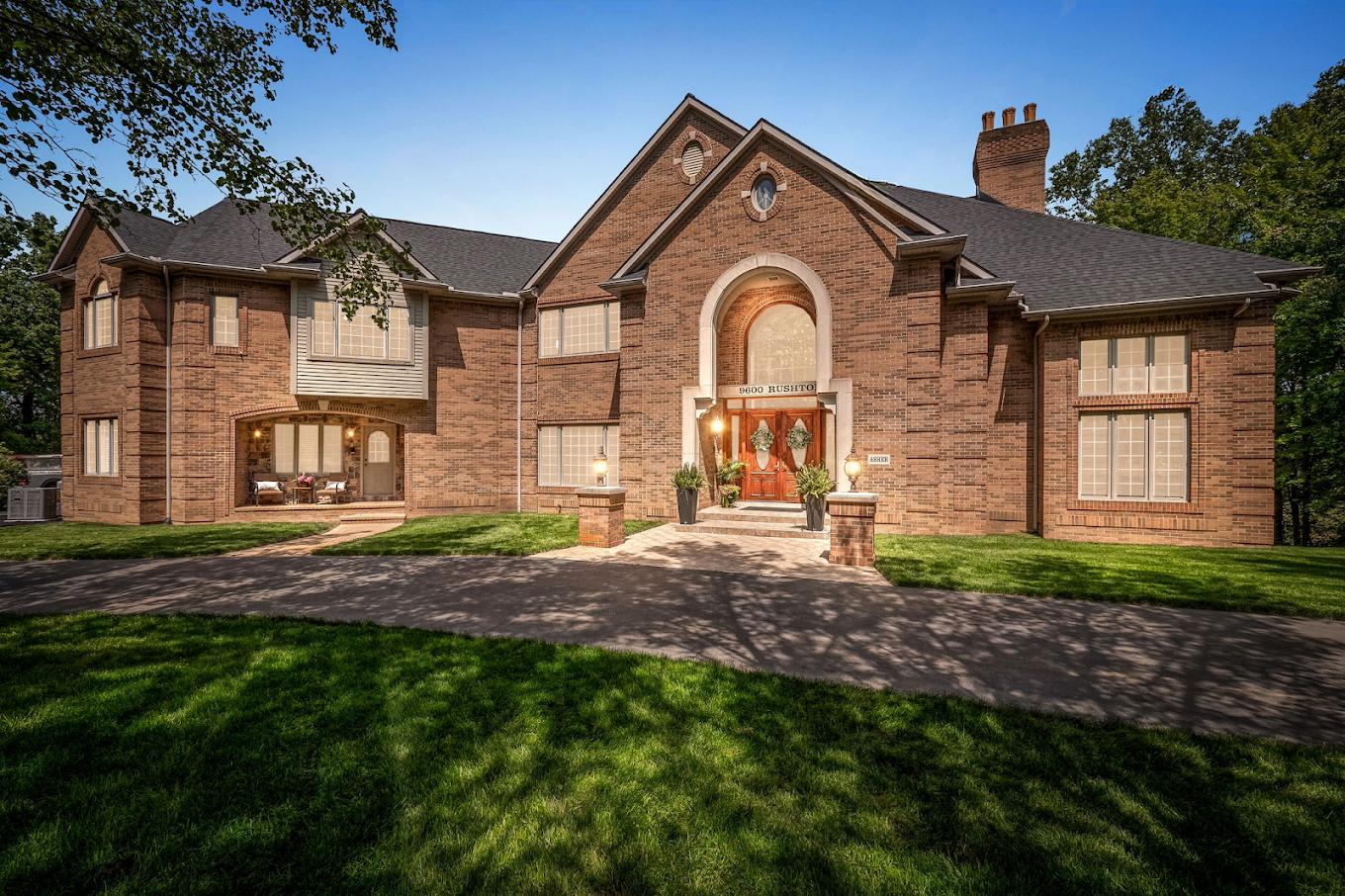 Brick building with archway and double front doors
