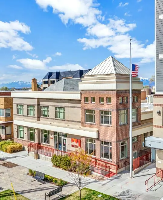 Two-story brick rehab facility with American flag outside