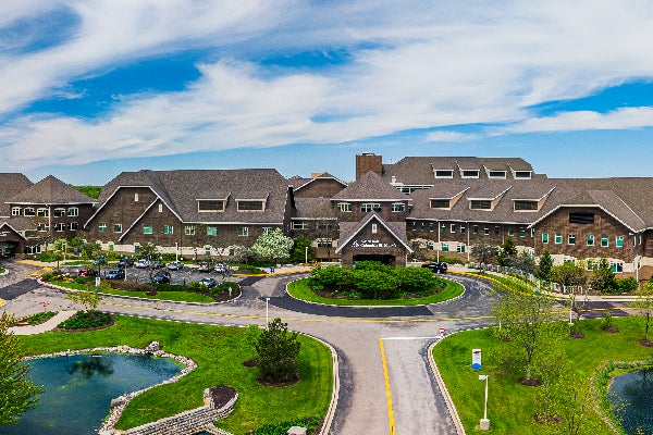 Hospital buildings with surrounding ponds and curved driveway