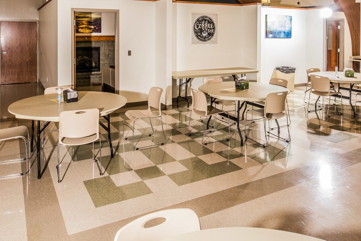Cafeteria with round tables for communal dining and groups
