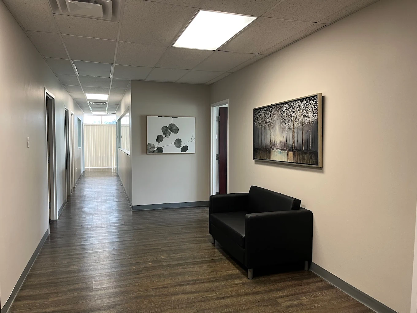 Interior hallway with artwork and seating