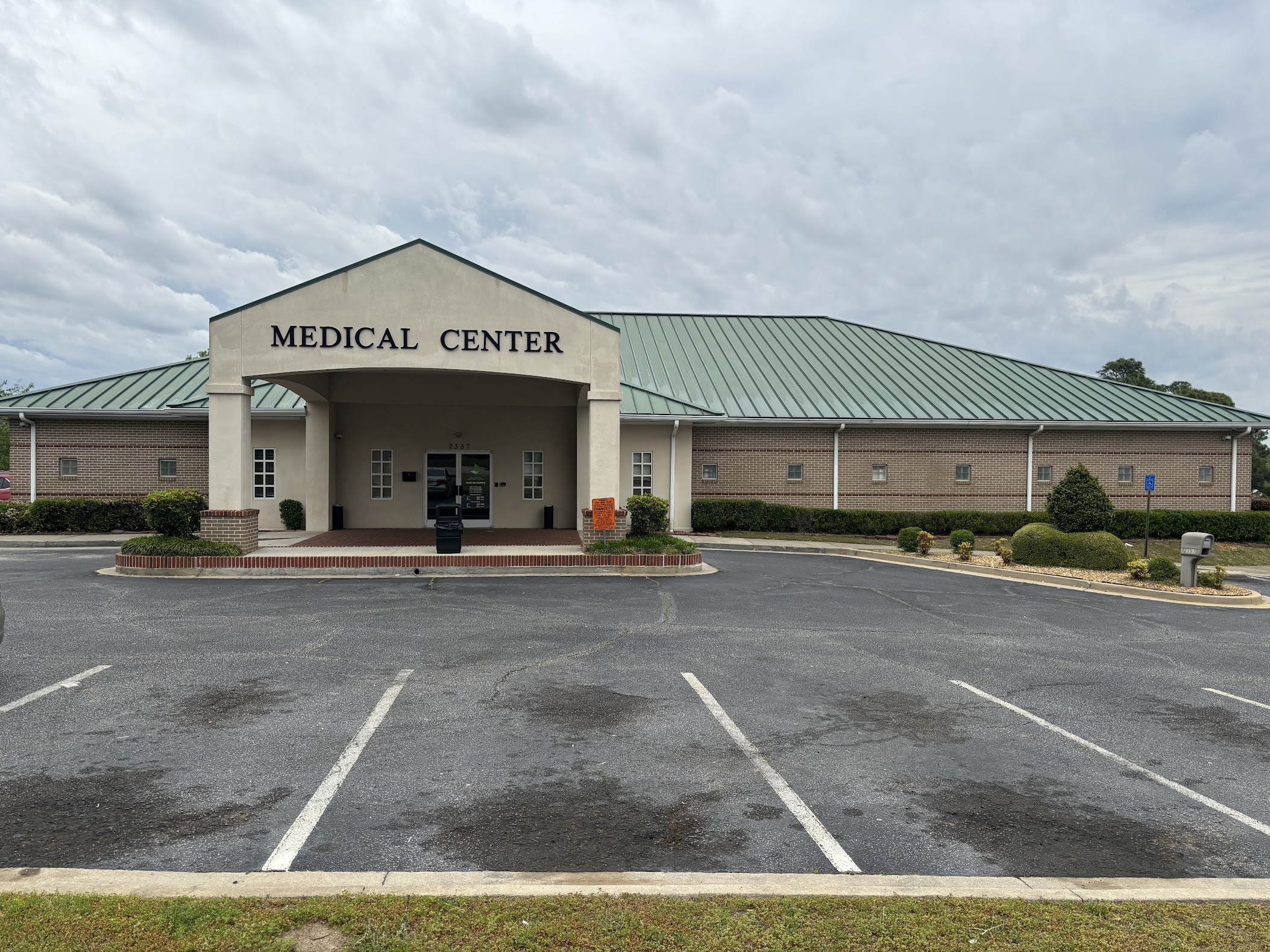 Front view of the medical center with parking spaces