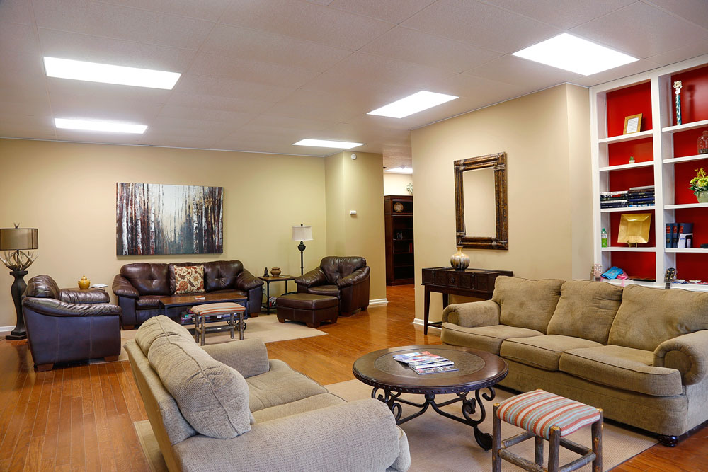 Cozy common area with couches and bookshelves