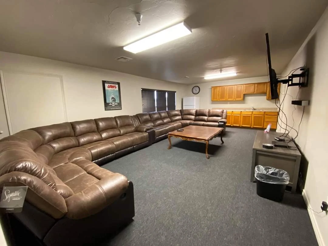 Community lounge with sectional seating and television