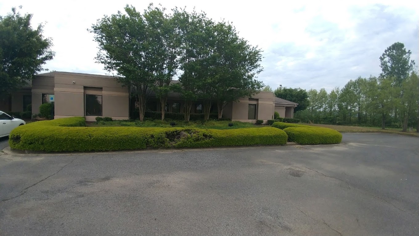 Facility exterior with accessible parking.