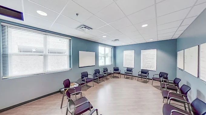 Group therapy room with chairs arranged in a circle