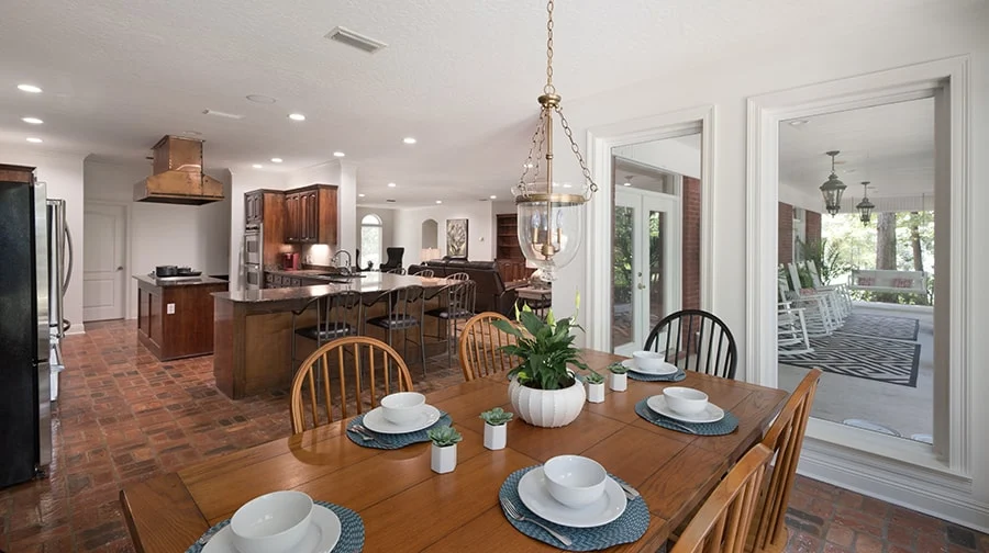 Dining table set for group meals near kitchen