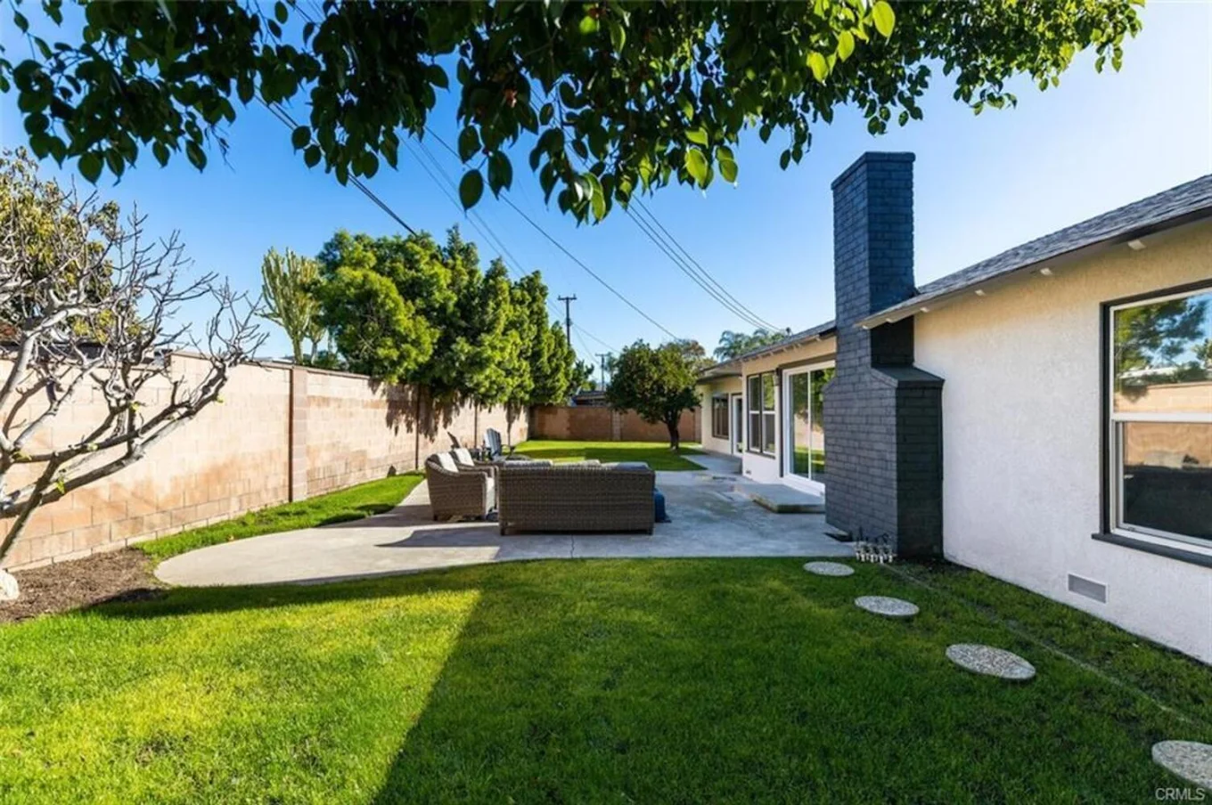 Outdoor seating area with wicker chairs and table
