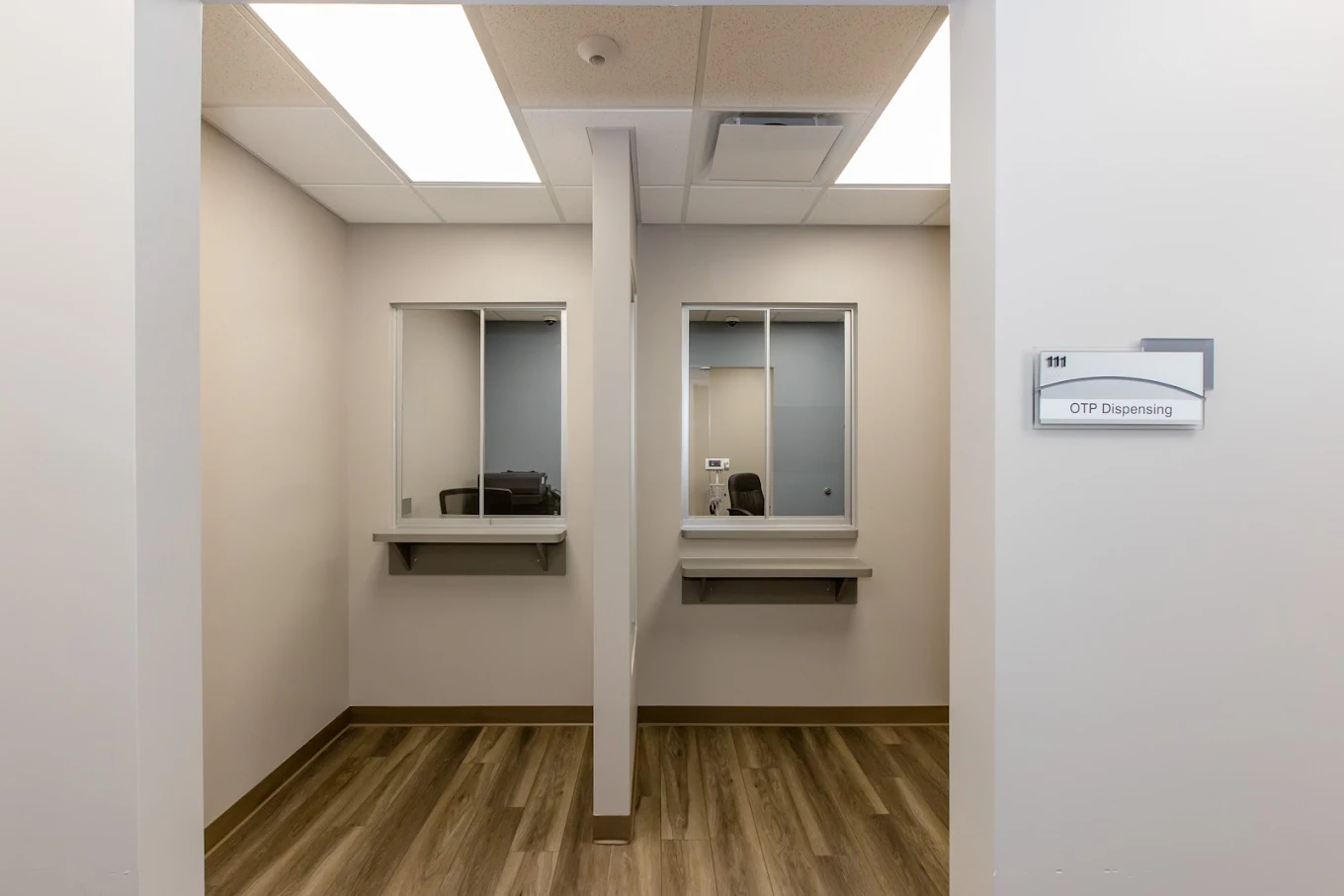 OTP dispensing area with two service windows and counters