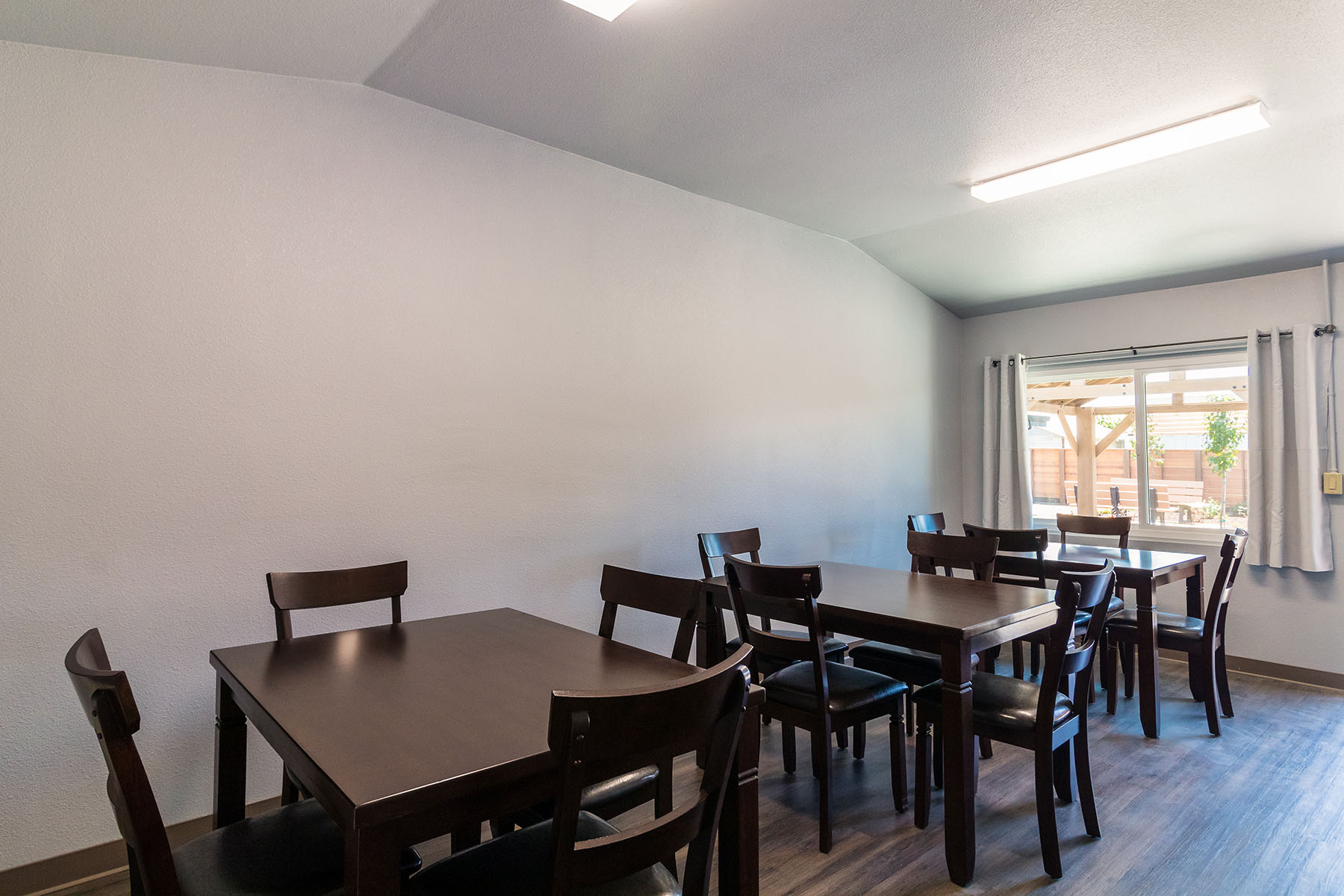 Communal dining hall with tables and seating