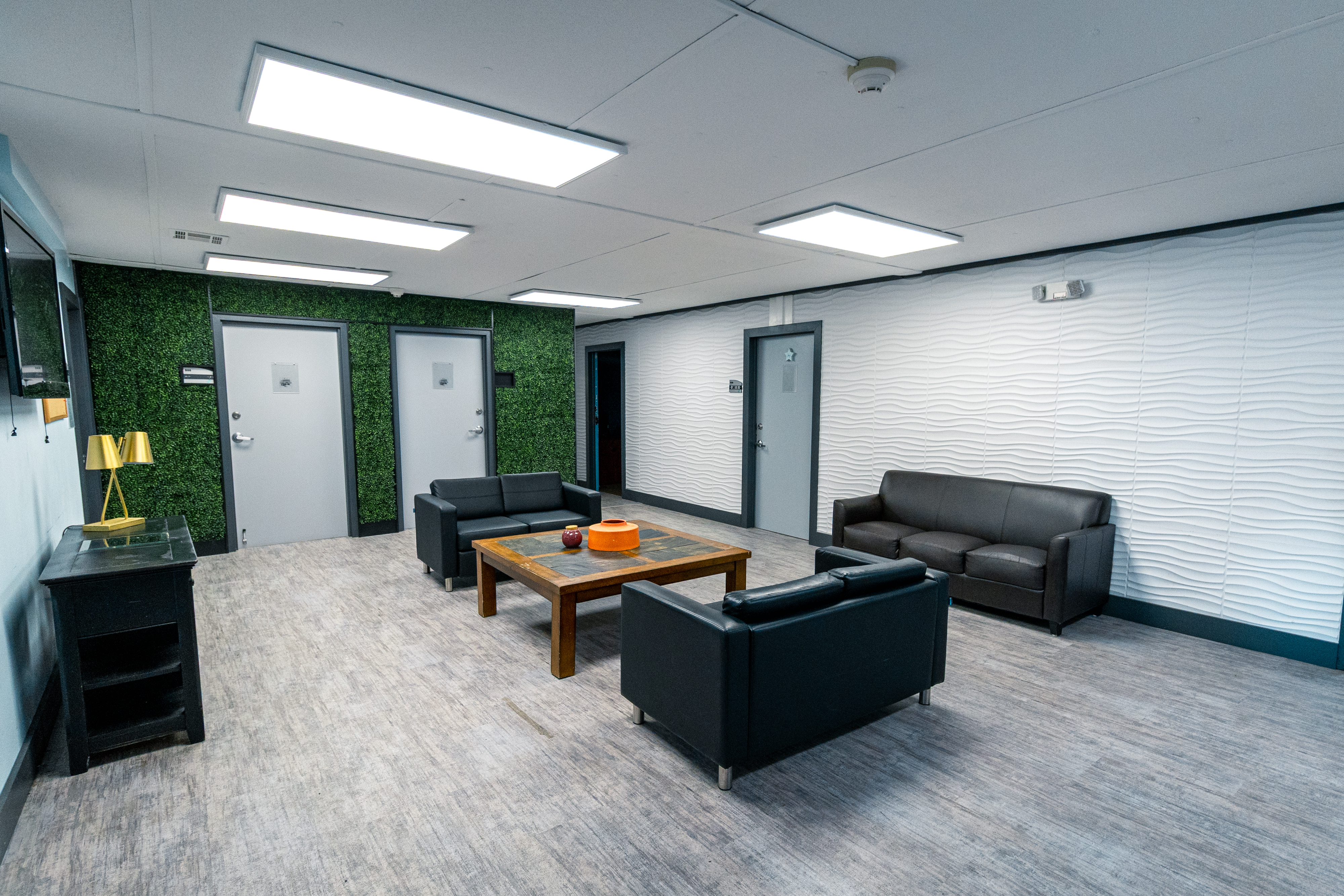 Interior lounge with sofas, a coffee table, and a calm, modern design.