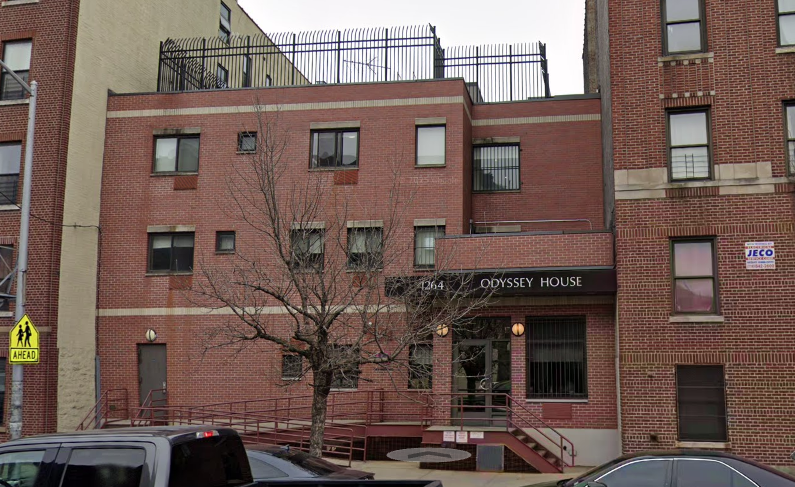Brick rehab facility exterior with front ramp entrance