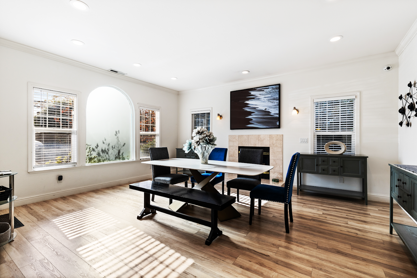 Modern dining area with fireplace and bench