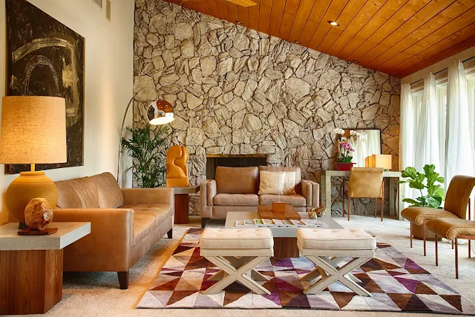 Comfortable lounge with stone accent wall and seating