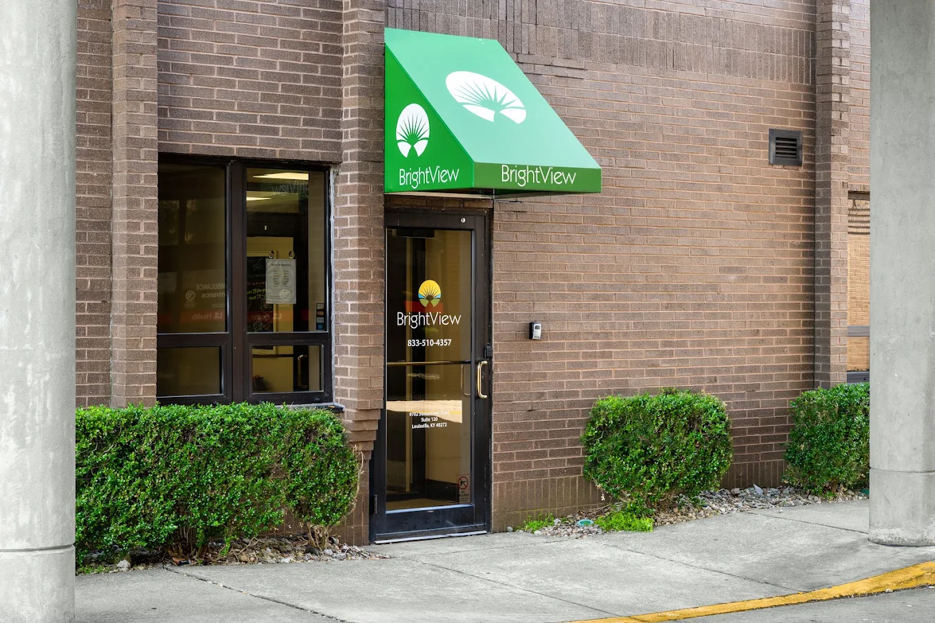 BrightView Louisville entrance with green awning and brick exterior