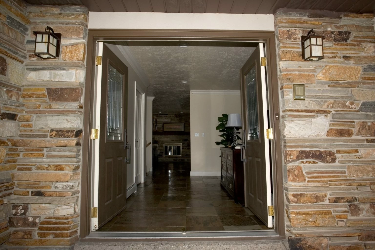 Double-door entrance with stone exterior detailing