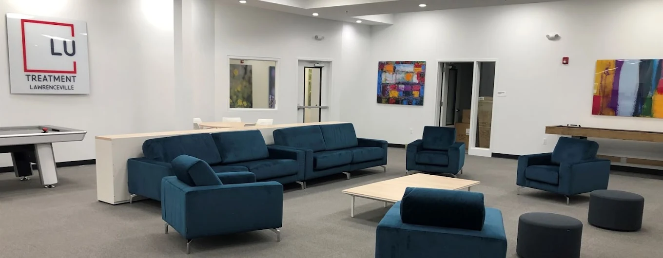 Large lounge with sofas, tables, and shared seating