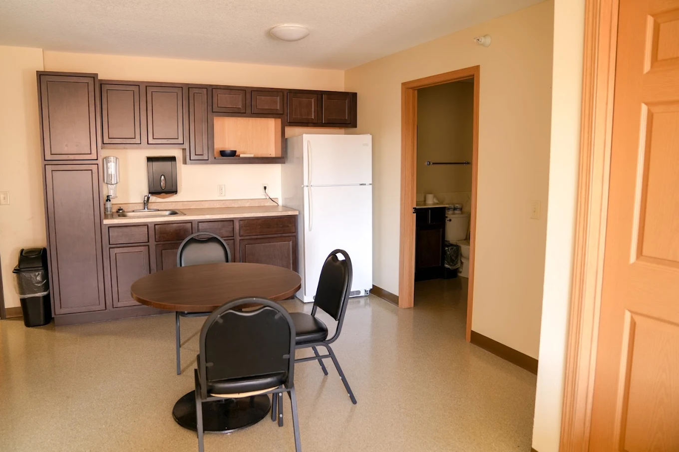 Small kitchen space with seating area.