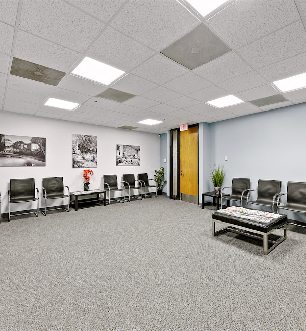 Spacious waiting area with seating and decor