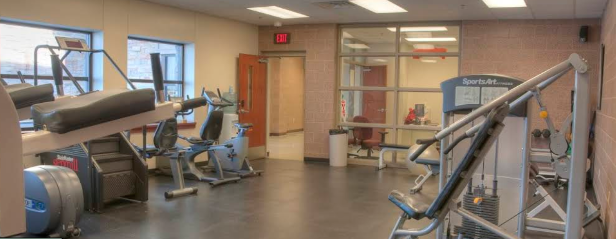 Fitness room with cardio and weight equipment