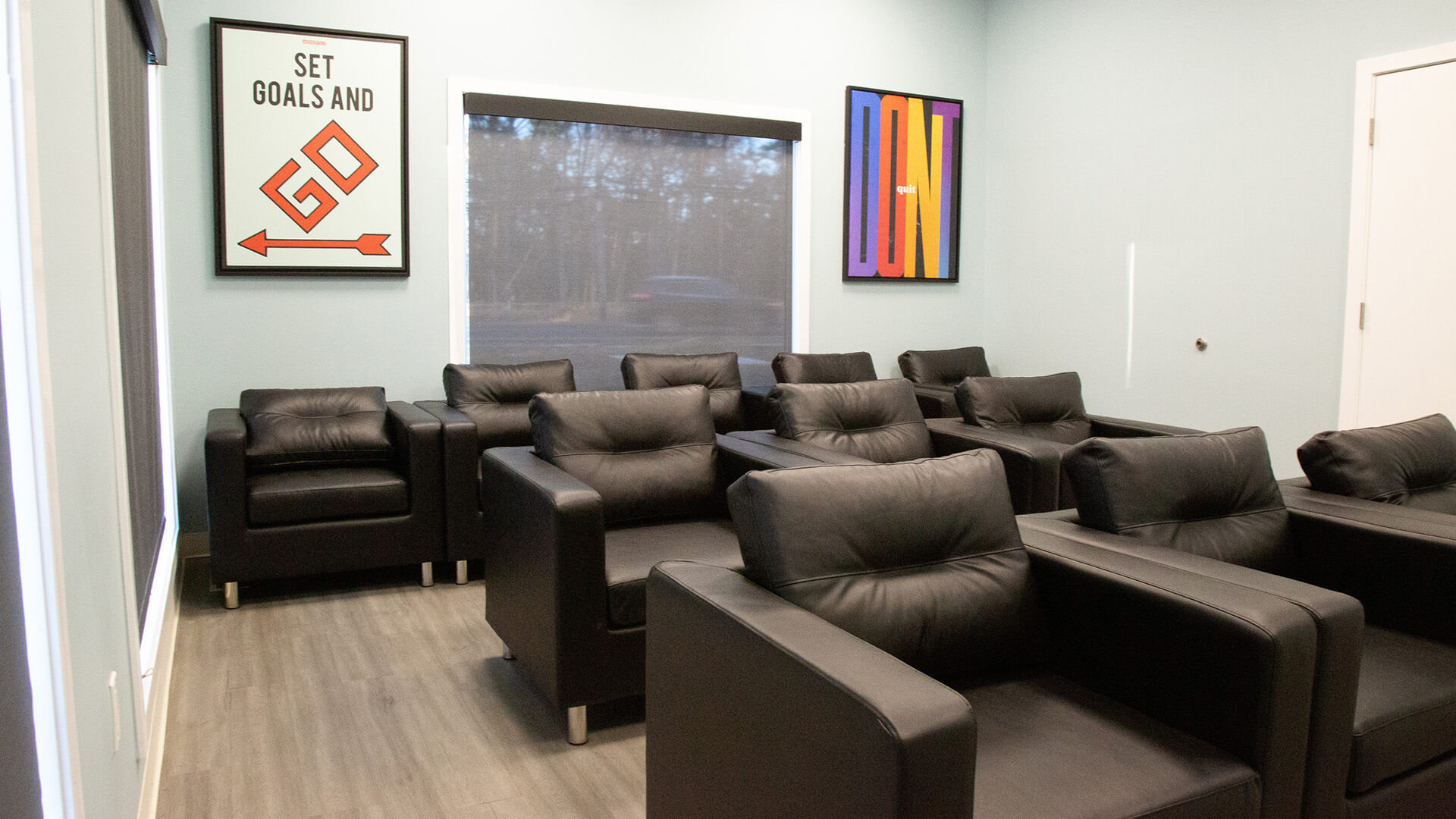 Lounge area with chairs and artwork.