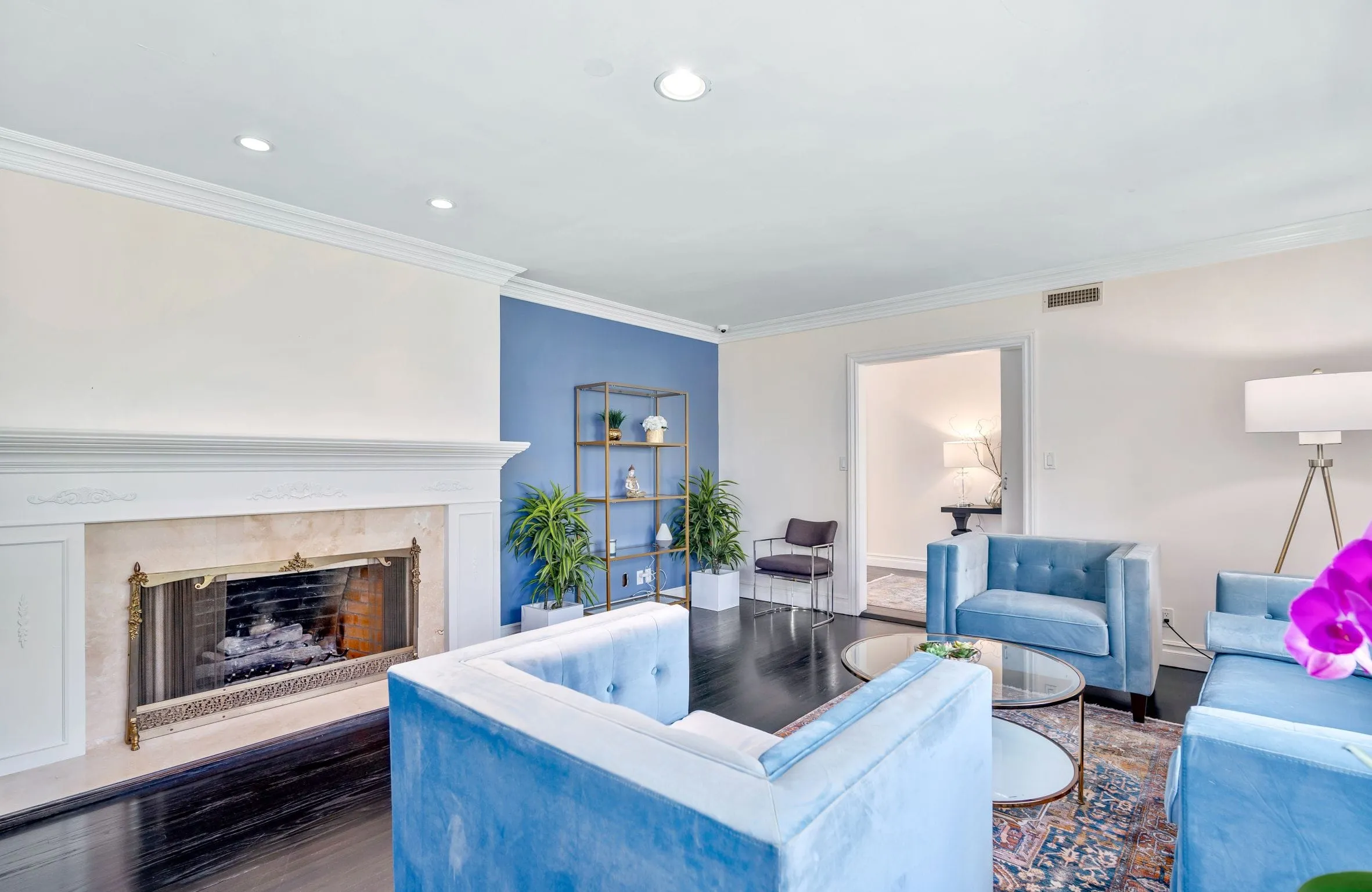 Lounge area with fireplace and seating at Innovate Recovery