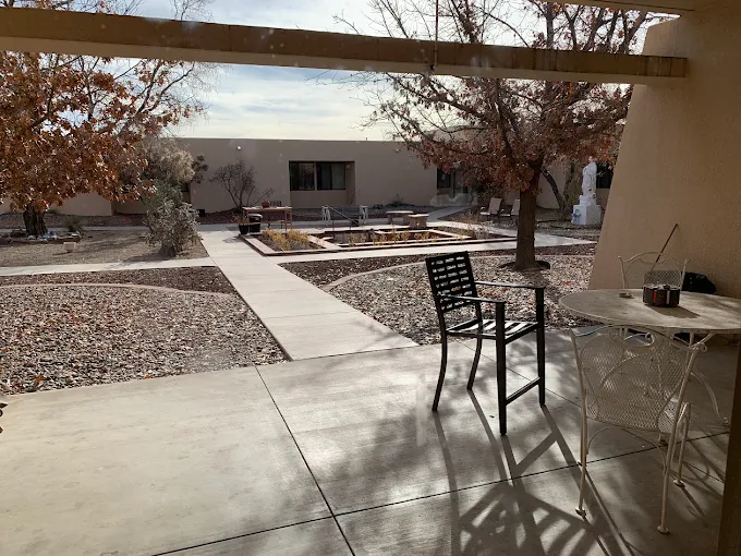 Covered patio overlooking peaceful outdoor courtyard