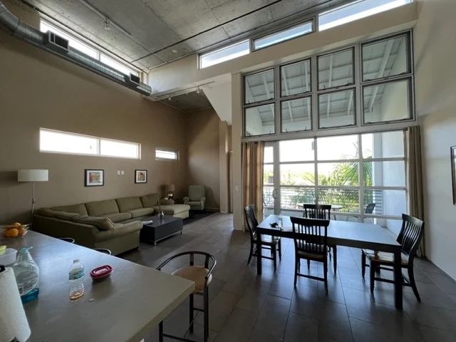 Open lounge and dining area in Naples rehab housing