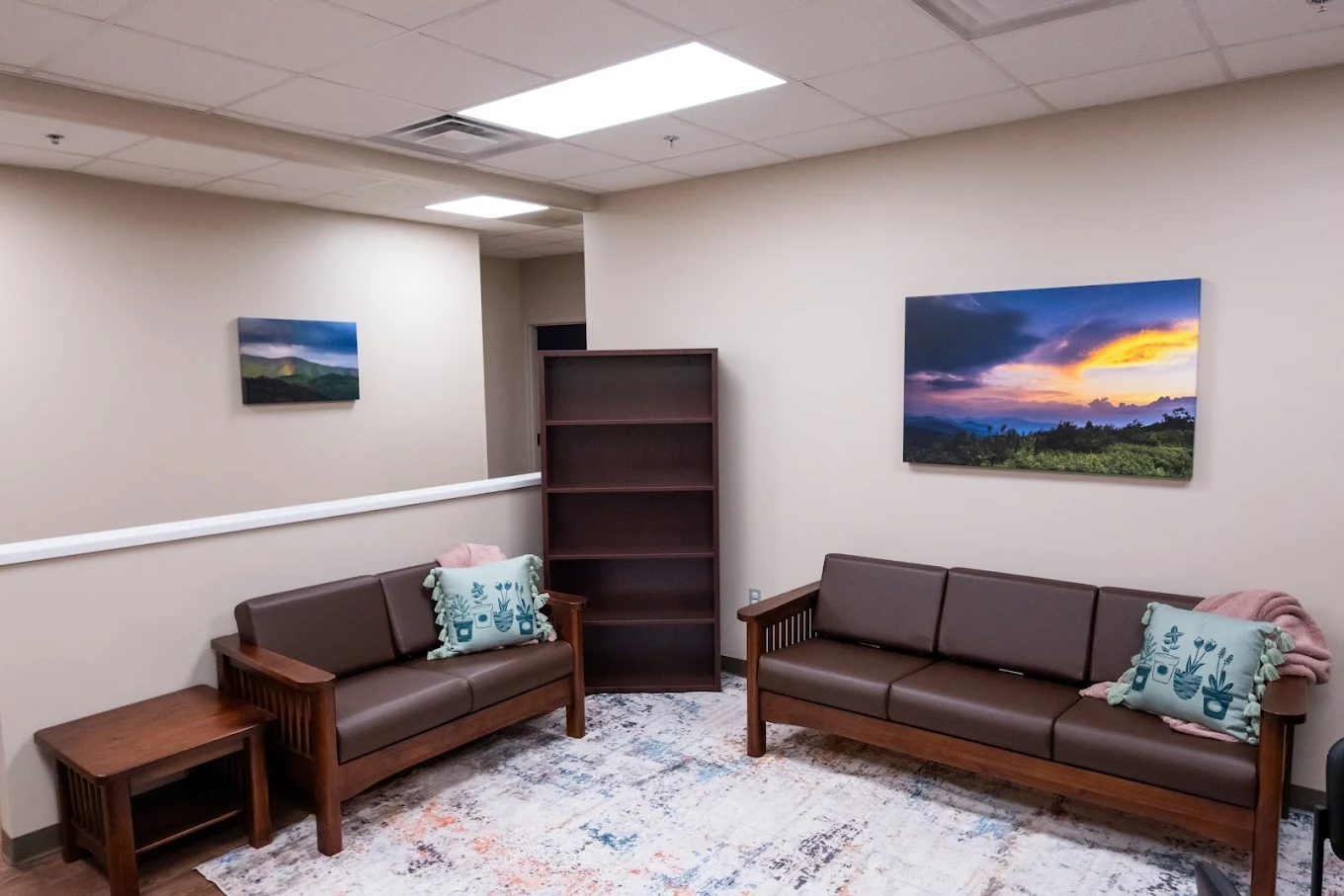 Quiet lounge with sofas and calming artwork