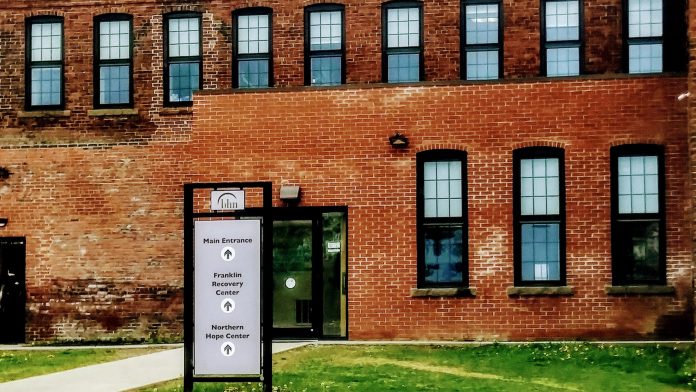 Brick building with entrance sign for Franklin Recovery and Hope Centers.