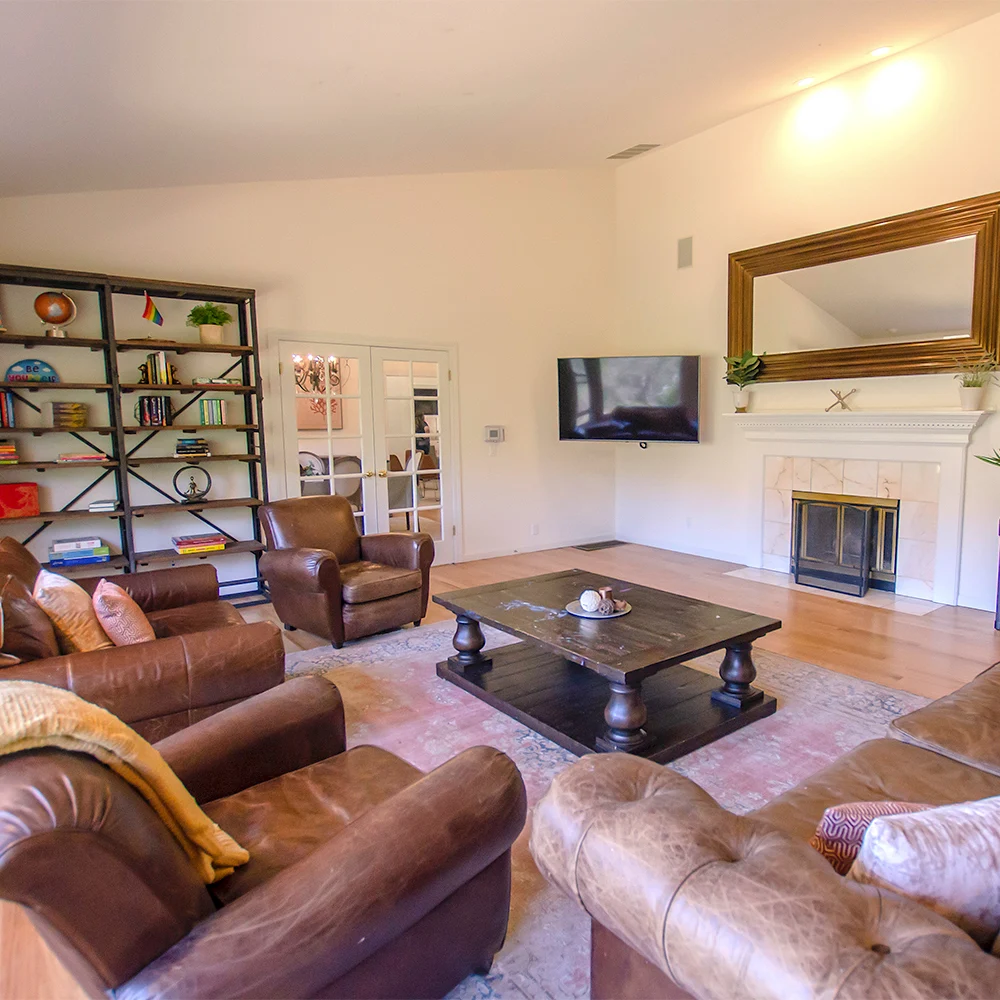 Living room with leather chairs and fireplace