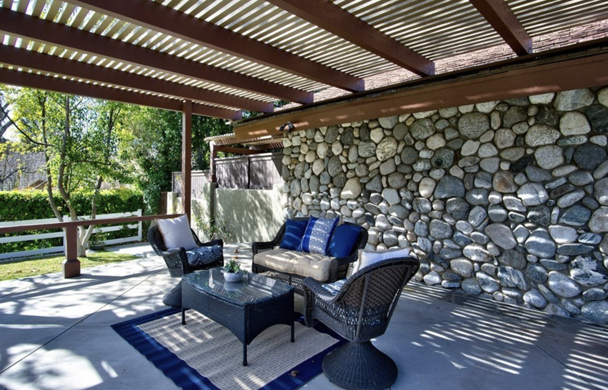 Outdoor seating area under a pergola.