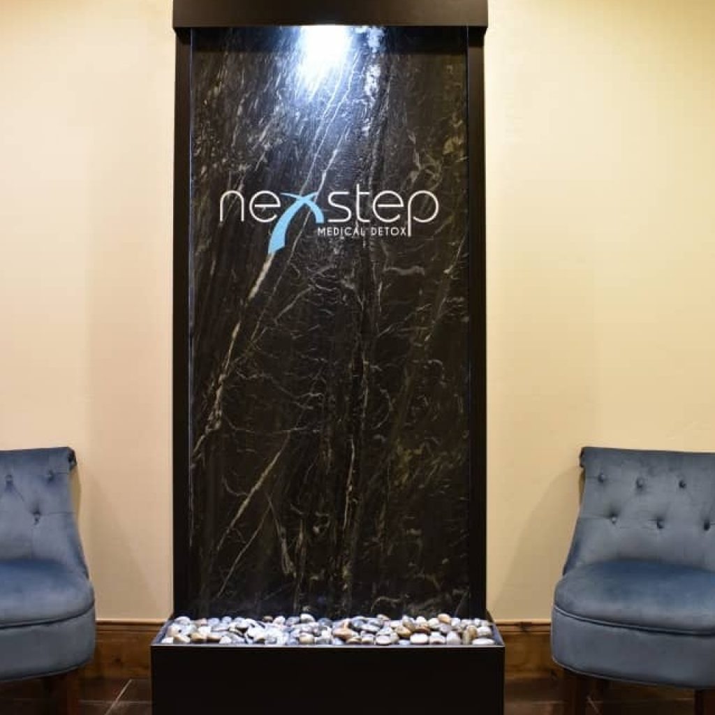 Marble water wall with Nexstep Medical Detox logo