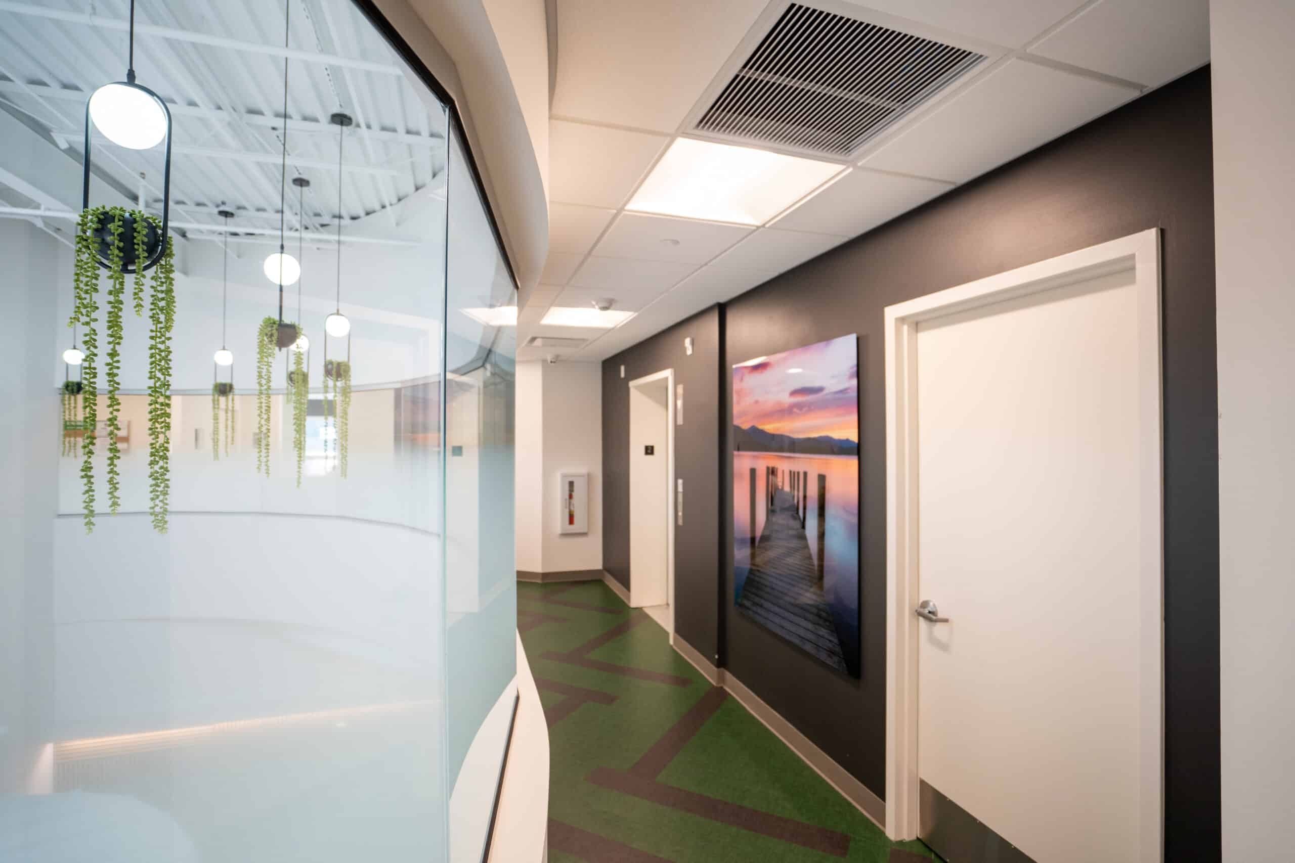 Modern hallway with pendant lights and artwork