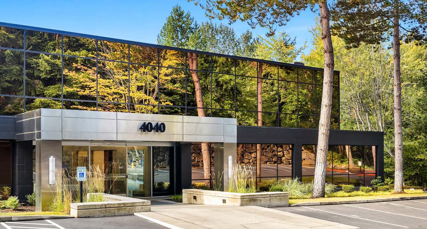 Facility front with accessible parking and signage.