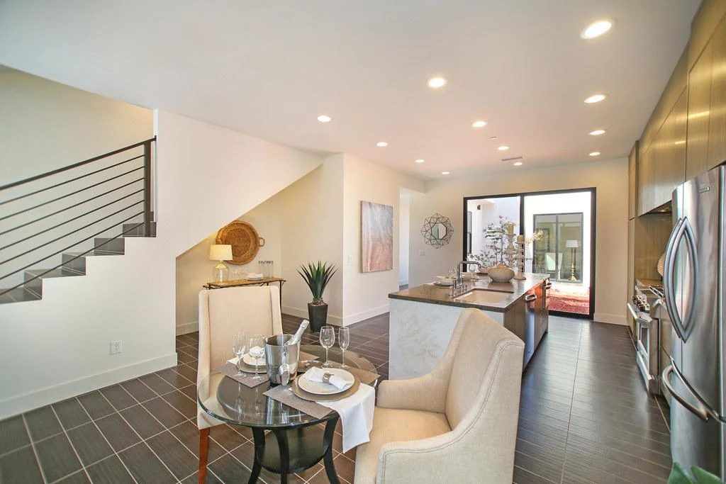Open kitchen with island and small dining table