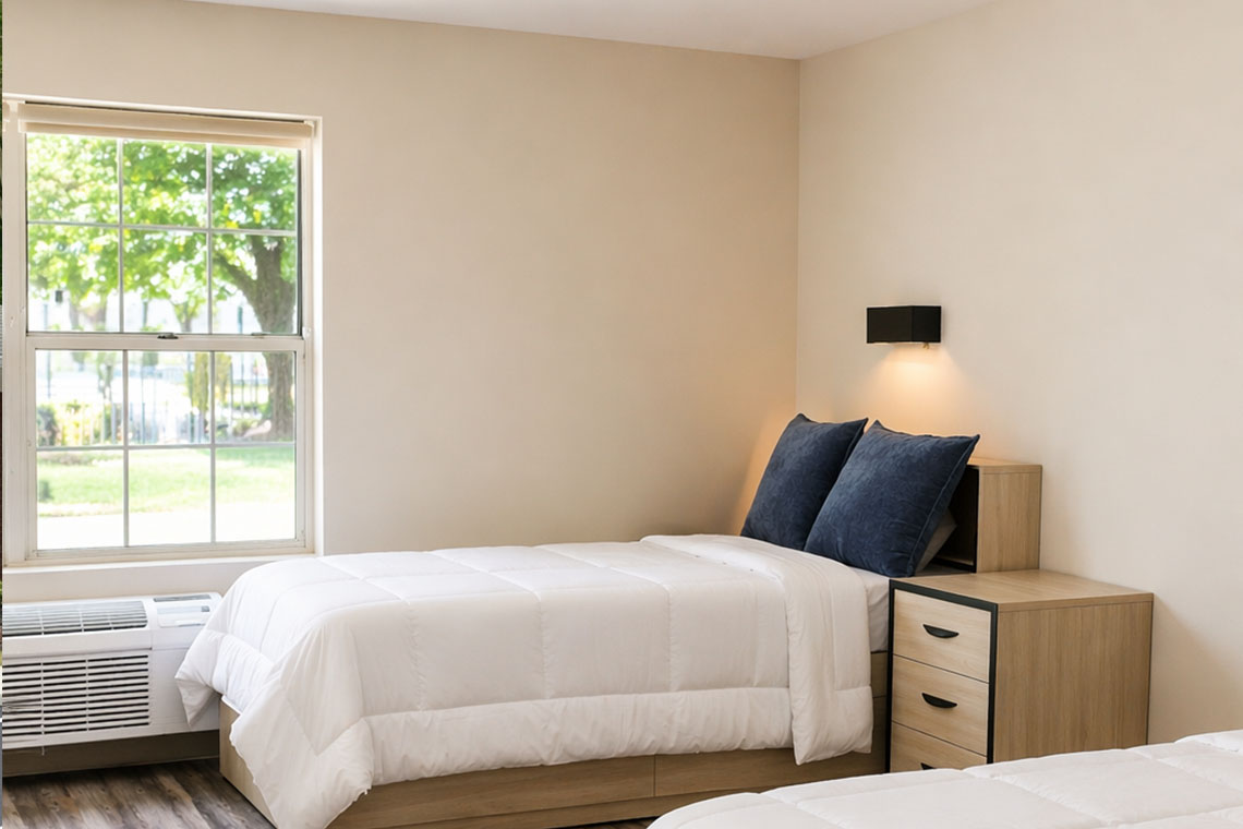 Shared inpatient rehab bedroom with natural light